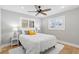 Comfortable bedroom with neutral walls, a ceiling fan, and a fluffy white rug at 9016 Bay Ne St, St Petersburg, FL 33702