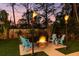 Relaxing backyard fire pit area with Adirondack chairs and tiki torches, great for entertaining at 9016 Bay Ne St, St Petersburg, FL 33702
