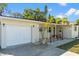 Charming single-story home featuring a well-maintained front yard and a one-car garage at 9016 Bay Ne St, St Petersburg, FL 33702