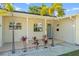 Inviting front porch with manicured landscaping and a stylish front door at 9016 Bay Ne St, St Petersburg, FL 33702