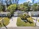 Charming single-Gathering home featuring well-maintained landscaping, a spacious driveway, and a two-car garage at 9016 Bay Ne St, St Petersburg, FL 33702