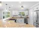 Bright kitchen with granite countertops and stainless steel appliances at 9016 Bay Ne St, St Petersburg, FL 33702