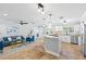 Open-concept living room and kitchen with tile flooring and modern finishes at 9016 Bay Ne St, St Petersburg, FL 33702