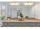 Bright bathroom featuring double sinks, granite countertops, and modern lighting at 9067 Cypress Trl, Seminole, FL 33777