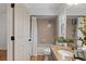 Bathroom featuring a shower-tub combo and granite countertop sink at 9067 Cypress Trl, Seminole, FL 33777