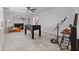 Cozy living room featuring a fireplace, stylish seating, and entertainment options such as a foosball table at 9067 Cypress Trl, Seminole, FL 33777