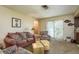 Cozy living room with patterned sofa, a wooden coffee table and access to a backyard patio at 908 Highview Dr, Palm Harbor, FL 34683