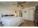 Spacious main bedroom with a ceiling fan, and access to the ensuite bathroom at 908 Highview Dr, Palm Harbor, FL 34683