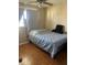 Cozy bedroom featuring a comfortable bed, a bright window, and soft, neutral tones at 10002 Daffodil N St # 51, Pinellas Park, FL 33782