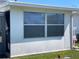 Bright sun room with large windows and an open view to the outside at 10002 Daffodil N St # 51, Pinellas Park, FL 33782
