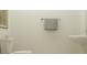 Bright bathroom features white toilet and sink with brushed metal towel bar at 11563 71St E Ave, Palmetto, FL 34221