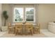 Well-lit dining room with woven chairs, a round table, and large windows at 11563 71St E Ave, Palmetto, FL 34221