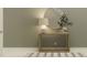 Cozy entryway with wooden console table, decorative mirror, and stylish decor at 11563 71St E Ave, Palmetto, FL 34221
