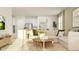 Open-concept living room with modern furniture, a stylish rug, and plenty of natural light at 11563 71St E Ave, Palmetto, FL 34221