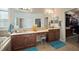 The primary bath boasts dual sinks, a large mirror, and a walk-in closet at 12339 Silton Peace Dr, Riverview, FL 33579