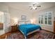 Tranquil bedroom with ample natural light, ceiling fan, and ensuite bathroom entrance at 12339 Silton Peace Dr, Riverview, FL 33579