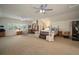 Spacious bonus room with ample natural light, carpet, ceiling fans, and lots of space at 12339 Silton Peace Dr, Riverview, FL 33579