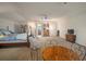 Large bonus room with sitting area, bed, and entertainment area, ideal for relaxation and entertainment at 12339 Silton Peace Dr, Riverview, FL 33579