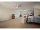 Large bonus room with multiple ceiling fans, windows with shutters, and carpeted flooring at 12339 Silton Peace Dr, Riverview, FL 33579
