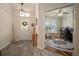 Open foyer that provides entry to an office space and the dining area of the home at 12339 Silton Peace Dr, Riverview, FL 33579