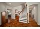 Spacious foyer showcasing hardwood floors, staircase, and decorative accents at 12339 Silton Peace Dr, Riverview, FL 33579