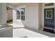 Inviting front entrance featuring a blue door with decorative glass, fresh neutral paint, and covered porch at 12339 Silton Peace Dr, Riverview, FL 33579