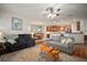 Open concept living space featuring hardwood floors and direct access to kitchen and dining areas at 12339 Silton Peace Dr, Riverview, FL 33579