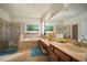 Luxurious main bathroom featuring a soaking tub, a glass shower, and dual sinks at 12339 Silton Peace Dr, Riverview, FL 33579