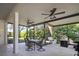 Spacious screened patio with ceiling fans, seating, and outdoor grill, perfect for entertaining at 12339 Silton Peace Dr, Riverview, FL 33579