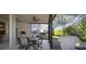 View of the screened patio with dining set, perfect for enjoying outdoor meals in a private setting at 12339 Silton Peace Dr, Riverview, FL 33579
