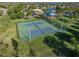 Aerial view of tennis courts and a community park with playground, perfect for recreation at 12339 Silton Peace Dr, Riverview, FL 33579
