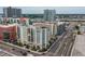 Exterior aerial view of the condo building with balconies in a dense urban setting with bright sky at 1238 E Kennedy Blvd # 703, Tampa, FL 33602