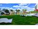 Green park with contemporary sculptures, palm trees, and benches, a relaxing outdoor recreation space at 1238 E Kennedy Blvd # 703, Tampa, FL 33602