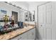 Neat bathroom featuring a well-lit vanity area, a large mirror, and a functional layout, perfect for daily routines at 12411 Eagleswood Dr # B, Hudson, FL 34667