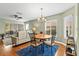 Open floor plan shows dining area with hardwood floors, chandelier, and natural light at 12411 Eagleswood Dr # B, Hudson, FL 34667