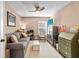Cozy living room complete with a sofa, ceiling fan, rug, and entertainment cabinet at 12411 Eagleswood Dr # B, Hudson, FL 34667