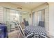 Outdoor patio with a table and seating, sliding glass door to the home, and grill at 12411 Eagleswood Dr # B, Hudson, FL 34667