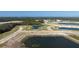 Panoramic aerial shot of new home community development with lakes and roadways at 12688 Lily Quartz Loop, Parrish, FL 34219