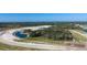 Expansive aerial view of the community, featuring multiple lakes, trees, and green spaces at 12688 Lily Quartz Loop, Parrish, FL 34219