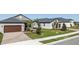 Well-maintained homes with attached garages, and manicured lawns at 12688 Lily Quartz Loop, Parrish, FL 34219