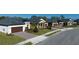 Attractive street view showcasing modern single-Gathering homes, landscaping, and paved driveways at 12688 Lily Quartz Loop, Parrish, FL 34219