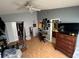 Bedroom featuring a ceiling fan, closet, and dresser with vanity at 14116 Trouville Dr, Tampa, FL 33624