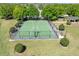 Aerial view of a fenced basketball court in a community featuring manicured landscaping at 14422 Scottburgh Glen Dr, Wimauma, FL 33598