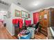 Bedroom featuring wood floors, a desk, an armoire, and plenty of storage space at 14422 Scottburgh Glen Dr, Wimauma, FL 33598