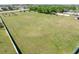 Large, well-maintained community field surrounded by trees and community amenities at 14422 Scottburgh Glen Dr, Wimauma, FL 33598
