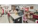 Open kitchen layout with granite countertops and adjacent living spaces at 14422 Scottburgh Glen Dr, Wimauma, FL 33598