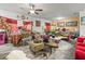 Spacious living room with hardwood flooring, decorative accents, and a dining area at 14422 Scottburgh Glen Dr, Wimauma, FL 33598