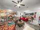 Open-concept living area with eclectic furnishings and a dining space, perfect for entertaining at 14422 Scottburgh Glen Dr, Wimauma, FL 33598