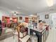 Spacious living area with kitchen island and view to dining area at 14422 Scottburgh Glen Dr, Wimauma, FL 33598