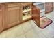 Kitchen cabinet with roll-out storage, providing easy access and organization for your cookware at 15657 Aurora Lake Cir, Wimauma, FL 33598
